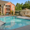 Resort-style swimming pool with lounge seating